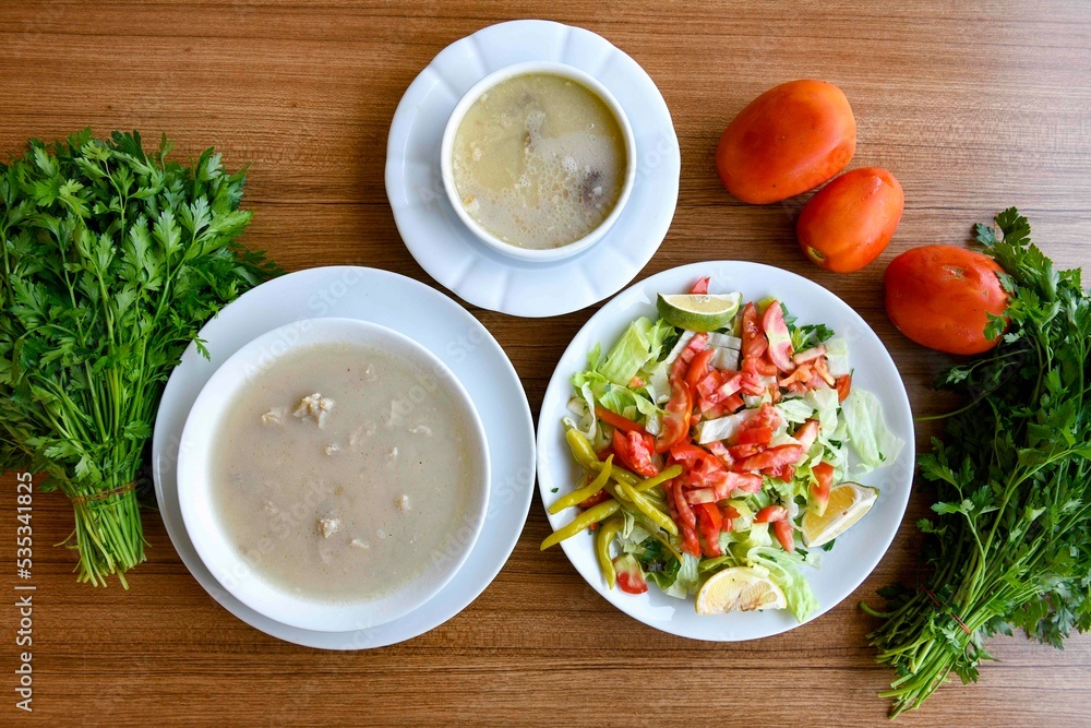 Table scene of assorted take out or delivery foods. Traditional Turkish cuisine. Various Turkish meal and appetizers. Top down view on a table. Table scene of assorted take out or delivery foods. Traditional Turkish cuisine. Various Turkish meal and appetizers. Top down view on a table.