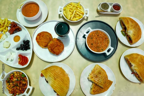 Table scene of assorted take out or delivery foods. Traditional Turkish cuisine. Various Turkish meal and appetizers. Top down view on a table.