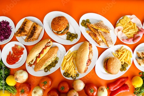 Traditional Turkish cuisine. Pizza, pita, pidesi, sucuk, hummus, kebab. Many dishes on the table. Serving dishes in restaurant. Background image. Top view, flat lay