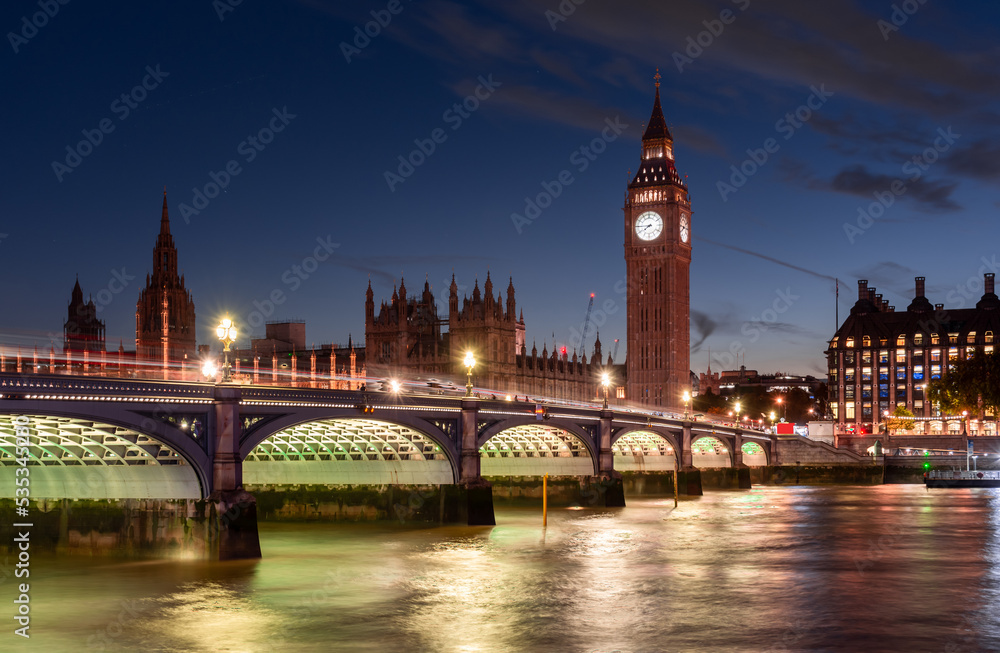The Parliament of England on the background of a dramatic sky, a beautiful evening cityscape
