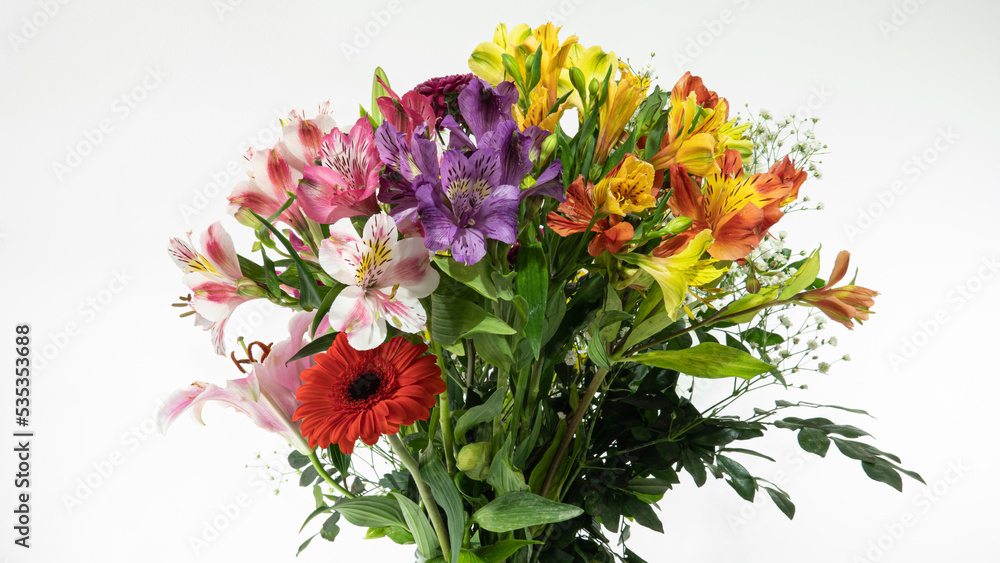 Beautiful multicolored flower bouquet on white background and closeup, with lilies, chrisantemos, pompom, wildflower, etc.