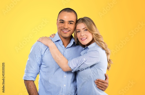 Happy couple posing together on the background