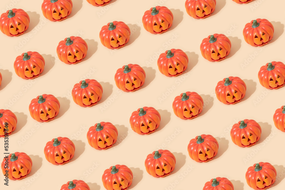 Jack O Lanterns on a light beige background. Seamless pattern Jack O Lanterns on a light beige background. Seamless pattern