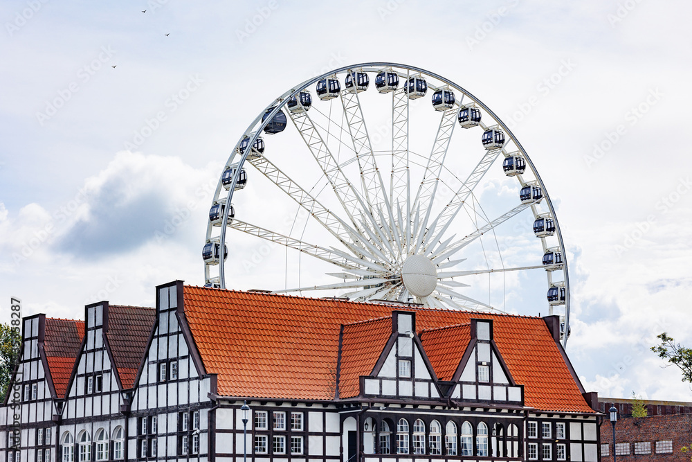 Fototapeta premium Beautiful architecture of the old city. Gdansk, Poland. European architecture. Ferris wheel.