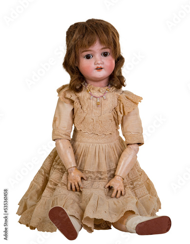 Bild auf Leinwand Isolated antique jointed sitting doll a linen dress