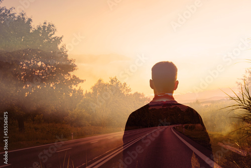 Silhouette of a person walking down the road. Life journey, path highway to freedom, life change concept. 