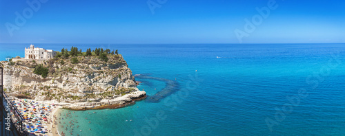 Tropea beach along the Tyrrhenian Sea Coast of Gods (Costa degli Dei). Sanctuary of Santa Maria dell'Isola is the symbol of Tropea, Calabria, southern Italy.