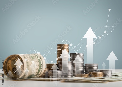 stack of coins with trading chart in financial concepts and financial investment business stock growth photo