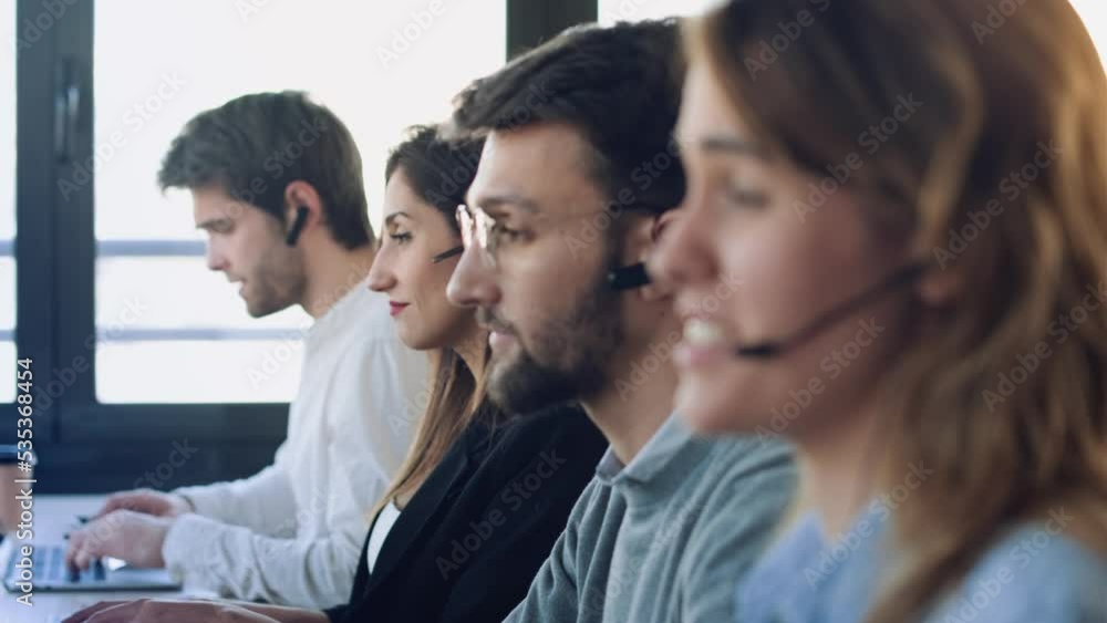 Video of successful concentrated business team working together with computers on coworking place. Video of successful concentrated business team working together with computers on coworking place.