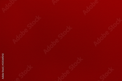 Red Muladhara chakra color on a molded embossed metal industrial background, colored, backdrop