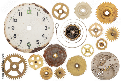 Design element. Obsolete metal clock gears dial, spring and mechanism.