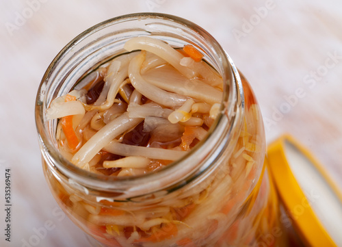 Close up of Chinese salad with sprouted mung beans in glass jar