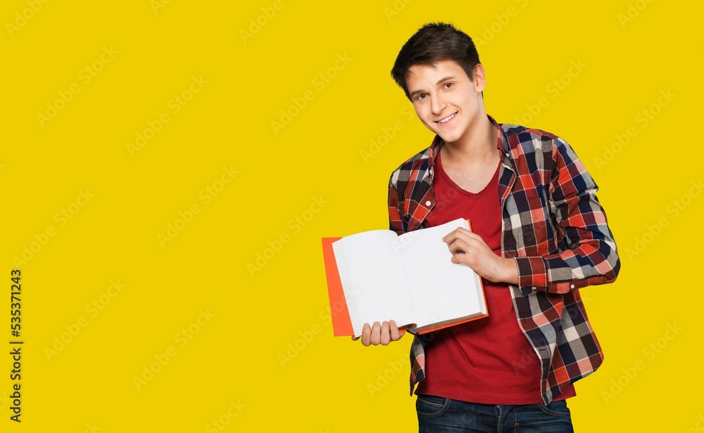 Happy young student standing with a backpack and posing Happy young student standing with a backpack and posing