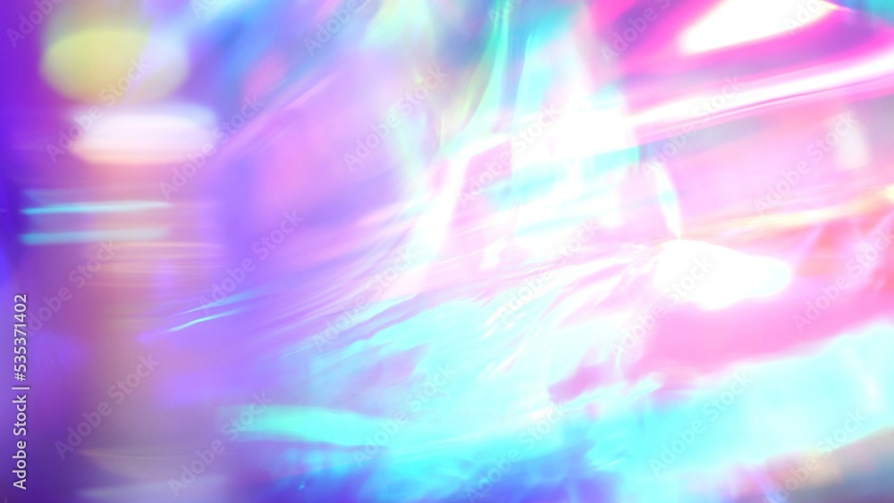 Iridescent glitters and shimmer texture. Kaleidoscope of colors. Purple pink teal glowing. Abstract festive background Iridescent glitters and shimmer texture. Kaleidoscope of colors. Purple pink teal glowing. Abstract festive background