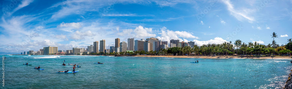 Fototapeta premium Surfers at Waikiki Beach, Honolulu, Hawaii