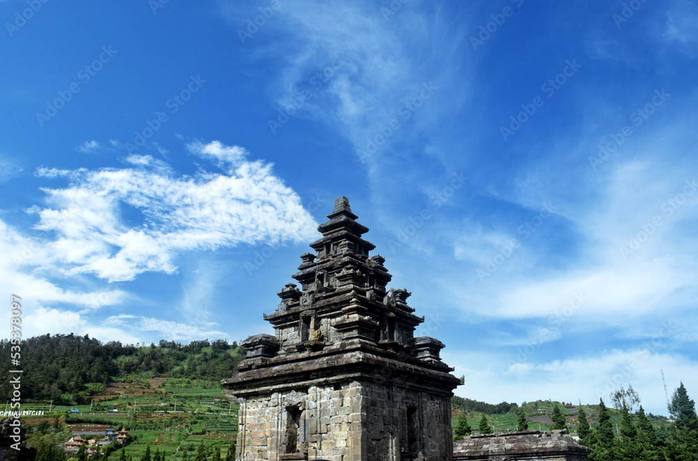 Arjuno Temple with a bright blue sky in the background in the Dieng plateau, Wonosobo, Central Java, Indonesia
