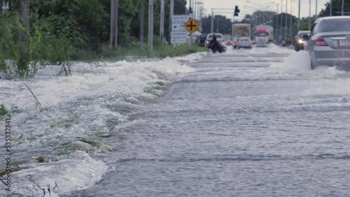 Video of the flooding, flooding the roads and making it impossible to go, Meng District, Thailand, on October 3, 2022, is a photograph from real flooding. With a slight color adjustment
