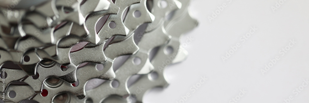 Shiny metal chrome chain cassette on iron mountain bike Shiny metal chrome chain cassette on iron mountain bike
