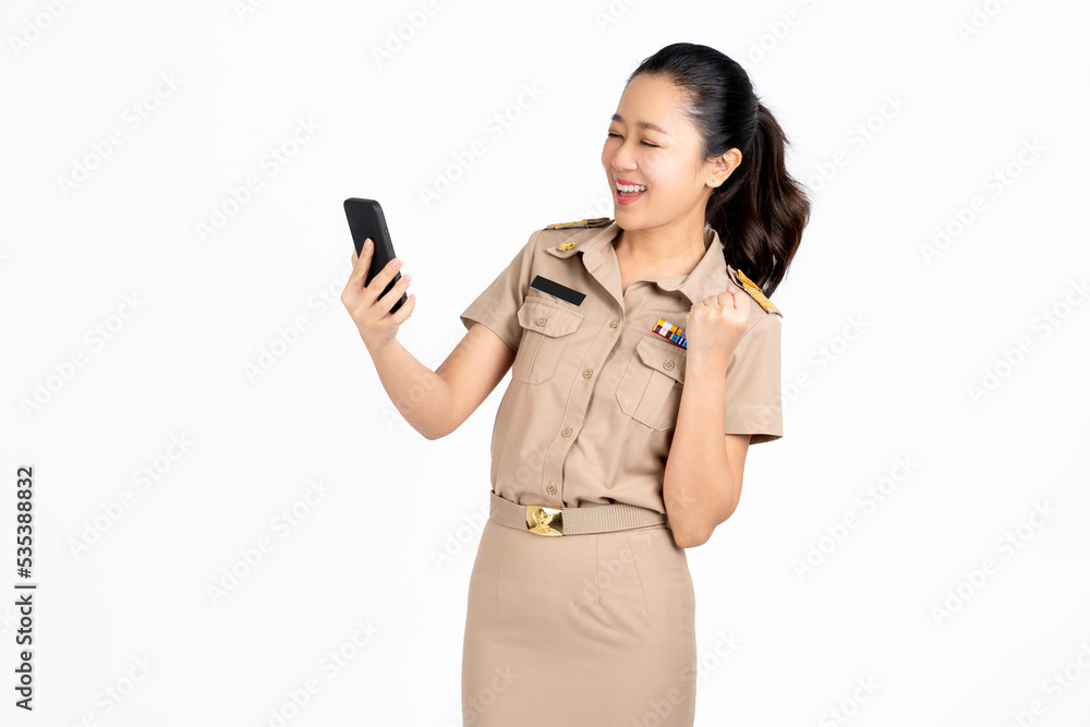Portrait of asian teacher looks surprised and excited at smartphone screen, receive pleasant notification. Portrait of asian teacher looks surprised and excited at smartphone screen, receive pleasant notification.