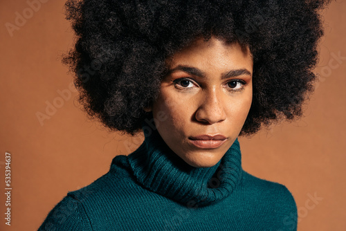 Woman in blue turtleneck sweater