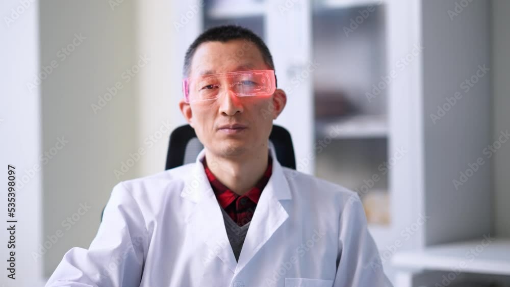chinese man technician with high technology eyeglasses in office chinese man technician with high technology eyeglasses in office