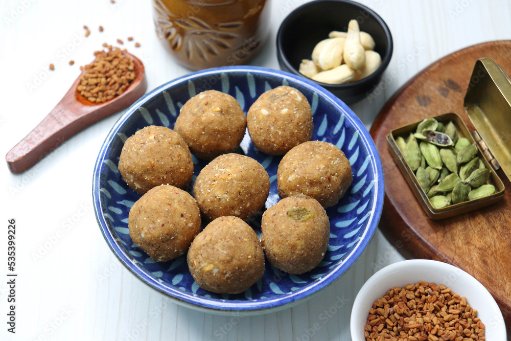 Gond and Methi Ke Laddu or Pinni. Fenugreek Laddu Made From Fenugreek Seeds, Saunf, Jaggery, and nuts. Immunity booster food for winters. Copy space Gond and Methi Ke Laddu or Pinni. Fenugreek Laddu Made From Fenugreek Seeds, Saunf, Jaggery, and nuts. Immunity booster food for winters. Copy space