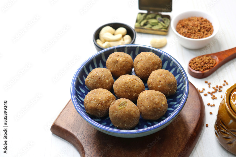 Gond and Methi Ke Laddu or Pinni. Fenugreek Laddu Made From Fenugreek Seeds, Saunf, Jaggery, and nuts. Immunity booster food for winters. Copy space Gond and Methi Ke Laddu or Pinni. Fenugreek Laddu Made From Fenugreek Seeds, Saunf, Jaggery, and nuts. Immunity booster food for winters. Copy space