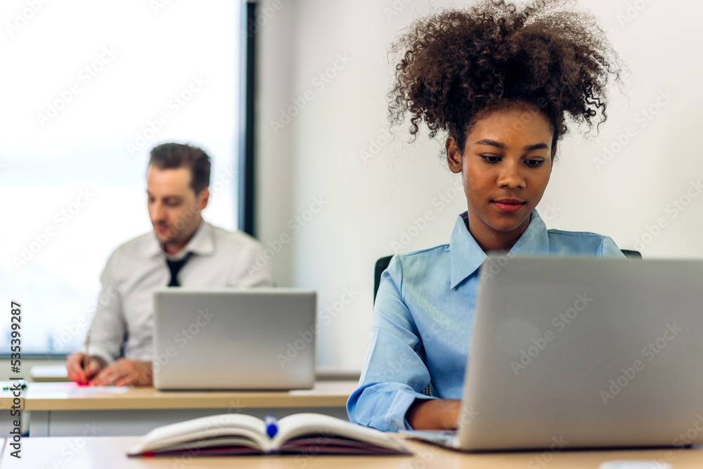 Young black african woman relaxing using laptop computer working and startup idea at office.Young creative african man working and typing on keyboard smart online at office company Young black african woman relaxing using laptop computer working and startup idea at office.Young creative african man working and typing on keyboard smart online at office company