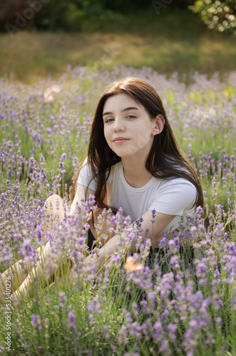 Beautiful young girl on lavender field.