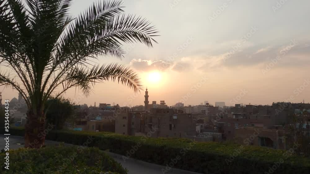 Cairo sunset cityscape as seen form Sunset view of Al-Azhar Park, public park in Cairo city, Egypt. Cairo sunset cityscape as seen form Sunset view of Al-Azhar Park, public park in Cairo city, Egypt.