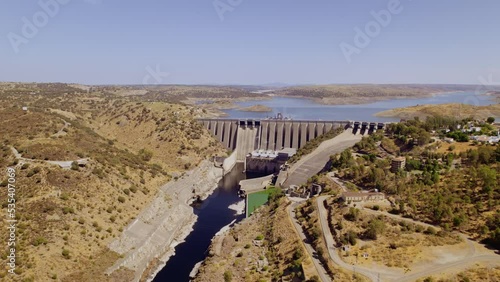 Aerial view of Alcantara dam. Presa del Embalse de José María de Oriol. Cinematic 4K