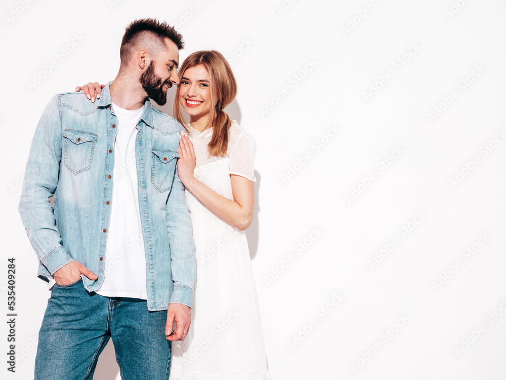 smiling beautiful woman and her handsome boyfriend. Happy cheerful family having tender moments near wall in studio. Pure cheerful models hugging. Embracing each other. Cheerful and happy smiling beautiful woman and her handsome boyfriend. Happy cheerful family having tender moments near wall in studio. Pure cheerful models hugging. Embracing each other. Cheerful and happy