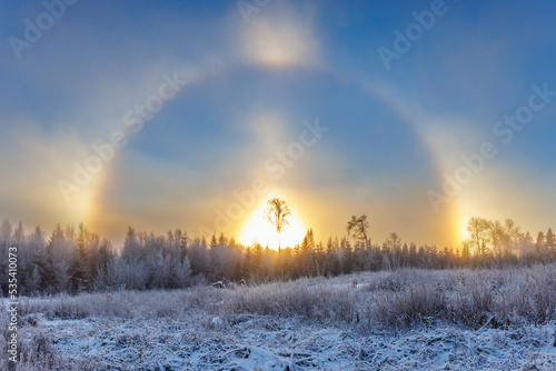 Cold winter day with a sun halo and sun dogs