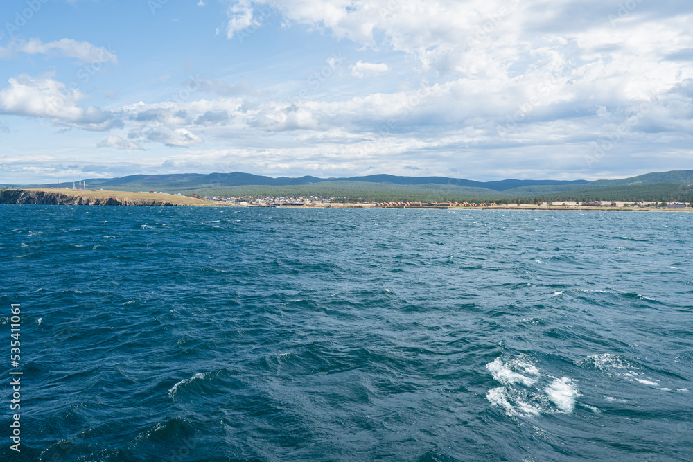 Beautiful summer landscape coastal and clear blue water of Baikal Lake Beautiful summer landscape coastal and clear blue water of Baikal Lake