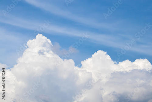 The fluffy cloud in the light blue sky in sunny day.  © guidenuk
