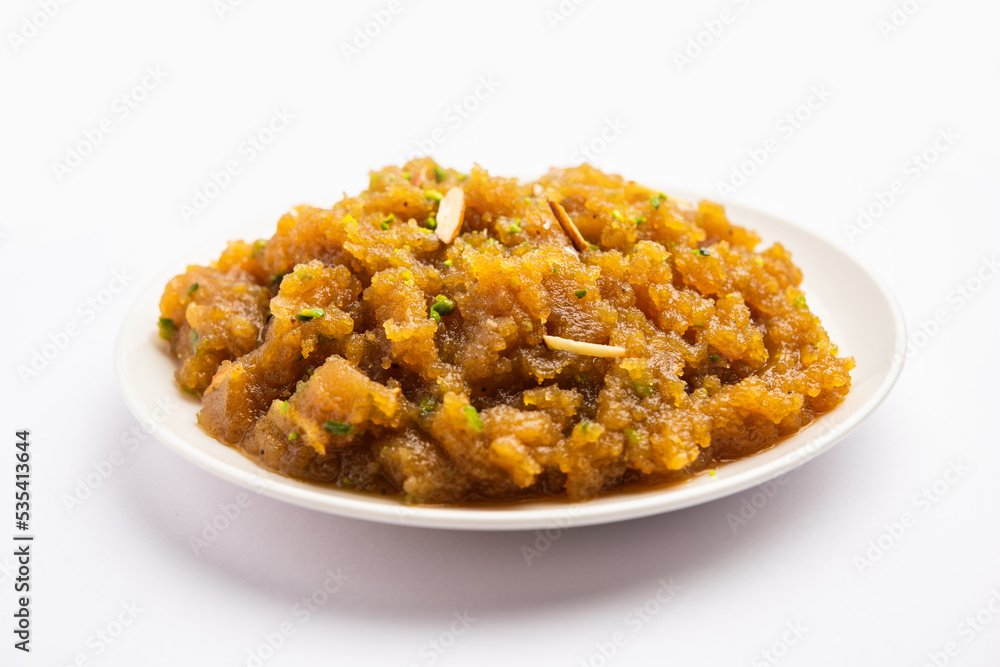 Besan Halwa, shira, sheera is a rich dessert made with gram flour, ghee and sugar Besan Halwa, shira, sheera is a rich dessert made with gram flour, ghee and sugar