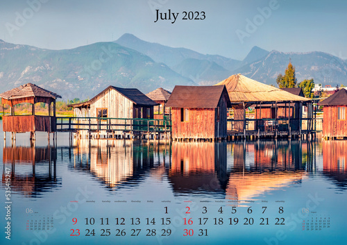 Horizontal wall calendar for 2023 year. July, B3 size. Set of calendars with amazing landscapes. Calm view of fishing dock on Patocut Laguna, Adriatic, Albania. Monthly calendar ready for print.. photo