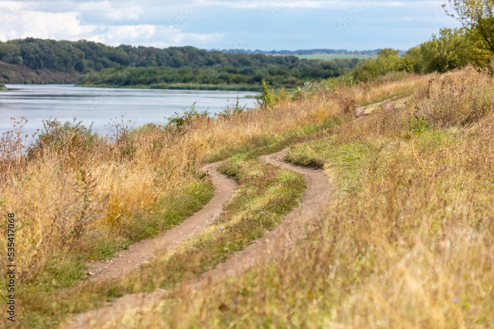 Dirt road in nature in summer. Dirt road in nature in summer.