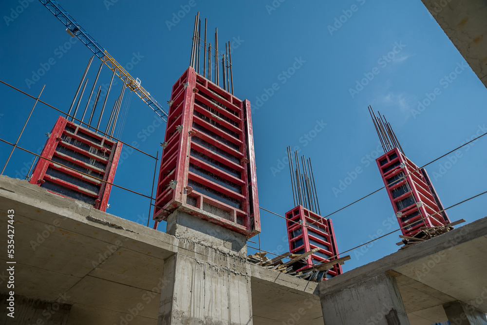 Column formwork and crane on house construction. Stock Photo Adobe Stock