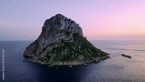 Aerial view of Es Vedra Ibiza during sunset. Showing ocean and clear skies. Cinematic 4K photo