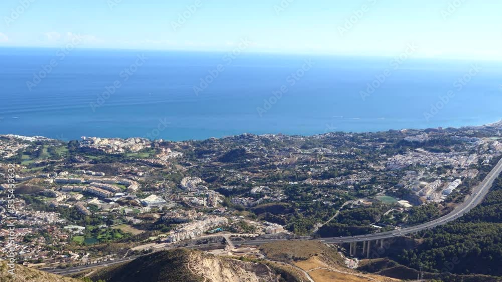 View of coastline and coastal motorway in Benalmadena. Benalmadena is a bustling tourist town between Malaga and Marbella, Spain. View of coastline and coastal motorway in Benalmadena. Benalmadena is a bustling tourist town between Malaga and Marbella, Spain.
