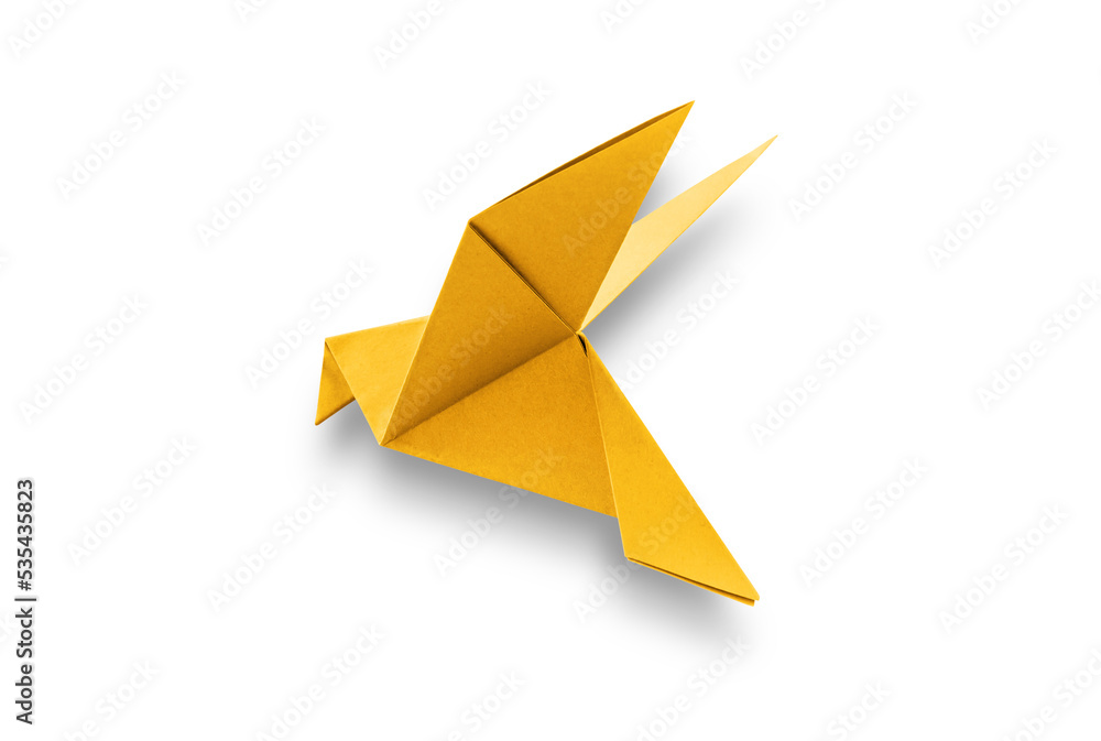 Yellow paper dove origami isolated on a white background Yellow paper dove origami isolated on a white background