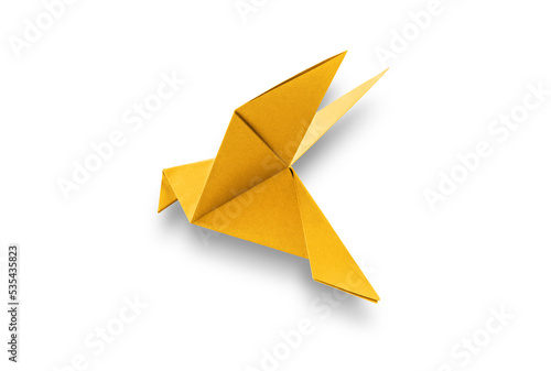 Yellow paper dove origami isolated on a white background