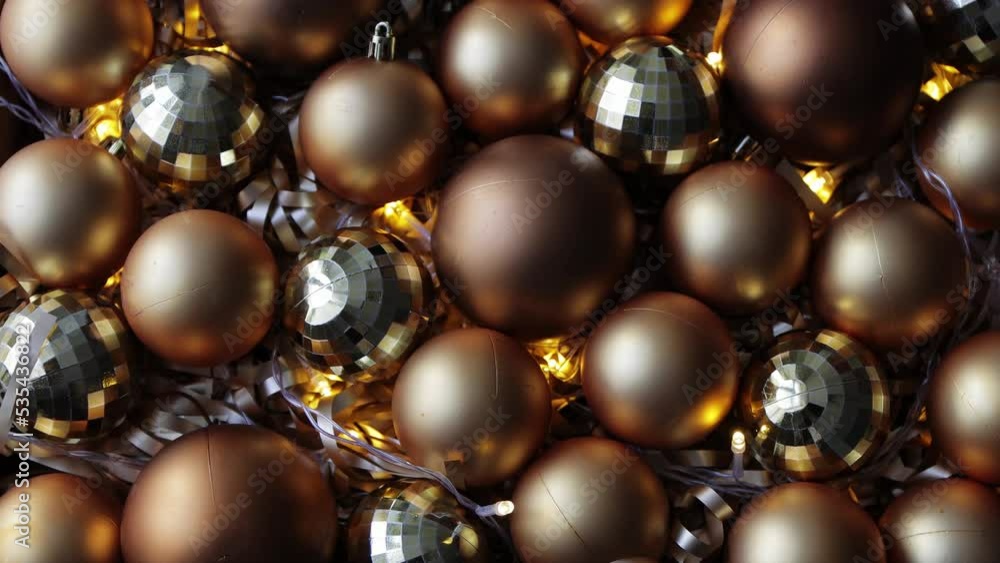christmas and new year background - close up of golden Christmas baubles with led lights christmas and new year background - close up of golden Christmas baubles with led lights