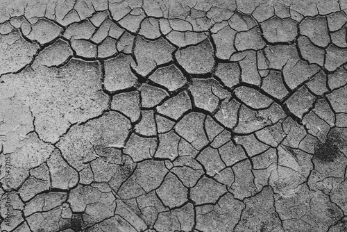 Waiting for monsoon to arrive. Cracks in dry earth due to lack of rain. Dry season in northern part of Sri Lanka.