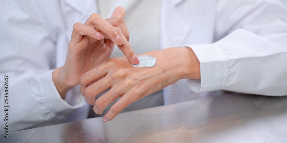 Close up look of Scientist is testing the result on hands from laboratory eco or natural cosmetic, medicine, Skin care, organic make-up, beauty treatment and essential oil experiment or research. Close up look of Scientist is testing the result on hands from laboratory eco or natural cosmetic, medicine, Skin care, organic make-up, beauty treatment and essential oil experiment or research.