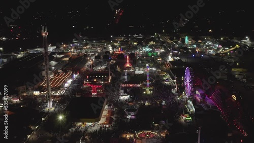 Festivity With Funfair Amusement Rides At The Washington State Fair During Night In Puyallup, WA, United States. Aerial Shot photo