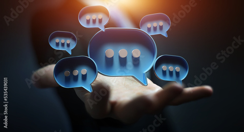 Businessman in dark using digital speech bubbles talk icons. Minimal conversation or social media messages floating over user hand. 3D rendering
