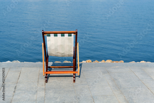 Deck chair on the lakeside