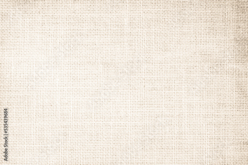 Jute hessian sackcloth canvas woven texture pattern background in light beige cream brown color blank empty.